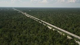 5K aerial stock footage of Interstate 10 through swampland in La Place, Louisiana Aerial Stock Footage | AX60_010