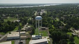 5K aerial stock footage fly over trailer park and approach a water tower, La Place, Louisiana Aerial Stock Footage | AX60_013