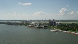 5K aerial stock footage a grain elevator and cargo ship near oil refinery in Reserve, Louisiana Aerial Stock Footage | AX60_018E