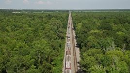 5K aerial stock footage fly over train cars to approach the engine, Edgard, Louisiana Aerial Stock Footage | AX60_065