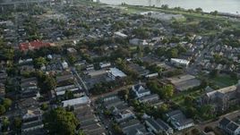 5K aerial stock footage fly over an urban neighborhood at sunset in Algiers, Louisiana Aerial Stock Footage | AX61_007