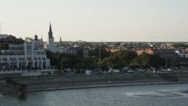5K aerial stock footage flyby Steamboat Natchez and Jax Brewery to reveal St. Louis Cathedral and Jackson Square at sunset, New Orleans, Louisiana Aerial Stock Footage | AX61_010