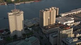 5K aerial stock footage of World Trade Center and Hilton Riverside Hotel at sunset, New Orleans, Louisiana Aerial Stock Footage | AX61_013