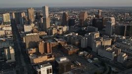 5K aerial stock footage of skyscrapers and city buildings at sunset in Downtown New Orleans, Louisiana Aerial Stock Footage | AX61_017