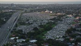 5K aerial stock footage of Greenwood Cemetery and First Baptist New Orleans church at sunset, Lakeview, Louisiana Aerial Stock Footage | AX61_030E