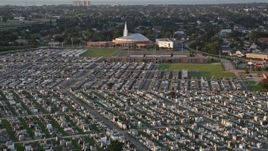 5K aerial stock footage fly over Greenwood Cemetery toward First Baptist New Orleans Church at sunset, Louisiana Aerial Stock Footage | AX61_032