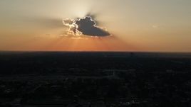 5K aerial stock footage of the sun behind a cloud over Lakeview District, New Orleans, Louisiana Aerial Stock Footage | AX61_034