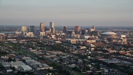 5K aerial stock footage approach skyscrapers in Downtown New Orleans at sunset, Louisiana Aerial Stock Footage | AX61_035