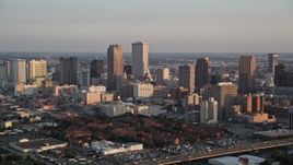 5K aerial stock footage of Downtown New Orleans skyscrapers and Iberville Projects at sunset, Louisiana Aerial Stock Footage | AX61_037