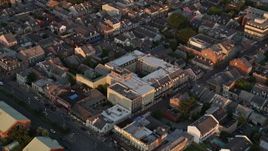 5K aerial stock footage orbit French Quarter city streets and buildings at sunset, New Orleans, Louisiana Aerial Stock Footage | AX61_042