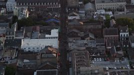 5K aerial stock footage follow famous Bourbon Street through French Quarter, New Orleans at sunset, Louisiana Aerial Stock Footage | AX61_043E