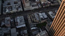 5K aerial stock footage of bird's eye view of the Bourbon and Canal Street intersection at sunset, Downtown New Orleans, Louisiana Aerial Stock Footage | AX61_046