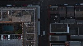5K aerial stock footage of bird's eye view of Bourbon Street in the French Quarter of New Orleans at sunset, Louisiana Aerial Stock Footage | AX61_047E