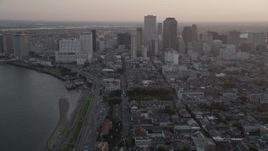 5K aerial stock footage of Downtown New Orleans at sunset, seen from the French Quarter and the Mississippi River, Louisiana Aerial Stock Footage | AX61_050