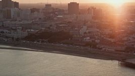 5K aerial stock footage of St. Louis Cathedral in the French Quarter of New Orleans, Louisiana at sunset, seen from the river Aerial Stock Footage | AX61_052