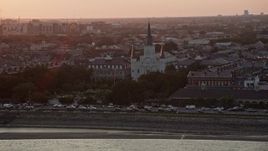 5K aerial stock footage of a reverse view of St. Louis Cathedral at sunset, French Quarter, New Orleans, Louisiana Aerial Stock Footage | AX61_054