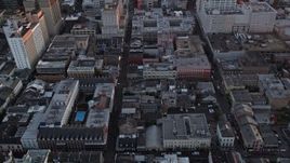 5K aerial stock footage of French Quarter's famous Bourbon Street and cross streets at sunset, New Orleans, Louisiana Aerial Stock Footage | AX61_059