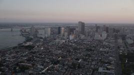 5K aerial stock footage of the French Quarter and skyscrapers in Downtown New Orleans at sunset, Louisiana Aerial Stock Footage | AX61_061