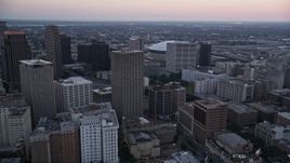 5K aerial stock footage of passing high-rises and skyscrapers in Downtown New Orleans at sunset, Louisiana Aerial Stock Footage | AX61_072