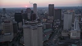 5K aerial stock footage fly west over Downtown New Orleans at sunset, Louisiana Aerial Stock Footage | AX61_074