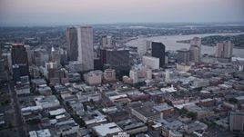 5K aerial stock footage flyby Plaza Tower and skyscrapers in Downtown New Orleans at sunset, Louisiana Aerial Stock Footage | AX61_077