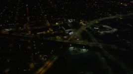 5K aerial stock footage of slow moving traffic on Mid-City New Orleans city streets at night, Louisiana Aerial Stock Footage | AX62_004