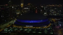 5K aerial stock footage approach Superdome and skyscrapers at night, Downtown New Orleans, Louisiana Aerial Stock Footage | AX62_005