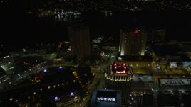 5K aerial stock footage follow Poydras Street to hotels in Downtown New Orleans at night, Louisiana Aerial Stock Footage | AX62_008E