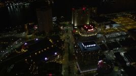 5K aerial stock footage follow Poydras Street through Downtown New Orleans at night, Louisiana Aerial Stock Footage | AX62_013E