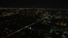 5K aerial stock footage of high-rises and skyscrapers in Downtown New Orleans at night, Louisiana Aerial Stock Footage | AX62_020E