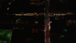 5K aerial stock footage of a view of Bourbon Street through French Quarter at night, New Orleans, Louisiana Aerial Stock Footage | AX62_027