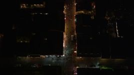 5K aerial stock footage bird's eye of small crowd and tourists on Bourbon Street in the French Quarter at night, New Orleans, Louisiana Aerial Stock Footage | AX62_028