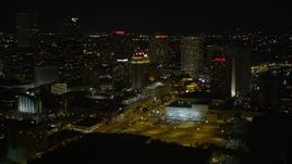 5K aerial stock footage of hotels around Harrah's in Downtown New Orleans at night, Louisiana Aerial Stock Footage | AX62_033