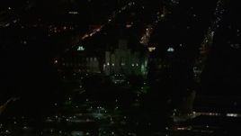 5K aerial stock footage flyby Jax Brewery to reveal St. Louis Cathedral and Jackson Square at night, French Quarter, New Orleans, Louisiana Aerial Stock Footage | AX62_039