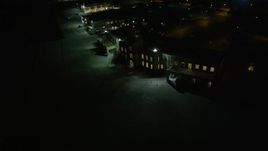 5K aerial stock footage of the main terminal of New Orleans Lakefront Airport at night, Louisiana Aerial Stock Footage | AX62_052
