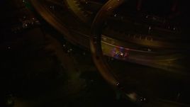 5K aerial stock footage ambulance near the Crescent City Connection Bridge at night, New Orleans, Louisiana Aerial Stock Footage | AX63_012E