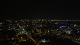 5K aerial stock footage of a wide view of Downtown New Orleans at night, Louisiana Aerial Stock Footage | AX63_028
