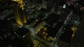 5K aerial stock footage of bird's eye of Downtown New Orleans skyscrapers and streets at night, Louisiana Aerial Stock Footage | AX63_031E