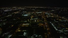 5K aerial stock footage approach Xavier University of Louisiana beside Interstate 10 in Mid-City New Orleans at night, Louisiana Aerial Stock Footage | AX63_033