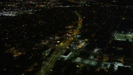 5K aerial stock footage fly over shops and Earhart Boulevard at night, Carrollton, New Orleans, Louisiana Aerial Stock Footage | AX63_034