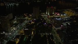 5K aerial stock footage of following Poydras Street through Downtown New Orleans at night, Louisiana Aerial Stock Footage | AX63_041E