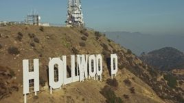 5K aerial stock footage of flying by the iconic Hollywood Sign in Los Angeles, California Aerial Stock Footage | AX64_0018