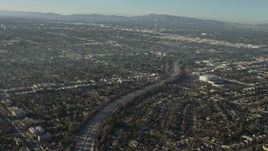 5K aerial stock footage of the Highway 170 freeway between suburban neighborhoods in North Hollywood, California Aerial Stock Footage | AX64_0027E
