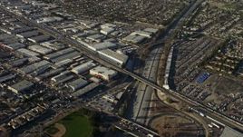 5K aerial stock footage of warehouse buildings beside Highway 170 freeway in North Hollywood, California Aerial Stock Footage | AX64_0030E