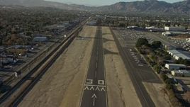 5K aerial stock footage of descending toward the runway at Whiteman Airport, Pacoima California Aerial Stock Footage | AX64_0040E
