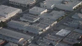 5K aerial stock footage fly over office buildings and tilt to their rooftops in Burbank, California Aerial Stock Footage | AX64_0059