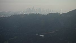 5K aerial stock footage of Downtown Los Angeles skyline seen from the Hollywood Hills, California Aerial Stock Footage | AX64_0066