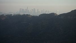 5K aerial stock footage of Downtown Los Angeles skyline shrouded in haze, California Aerial Stock Footage | AX64_0067E