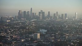 5K aerial stock footage of Downtown Los Angeles and city sprawl in haze, California Aerial Stock Footage | AX64_0076E