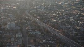 5K aerial stock footage of Highway 101 by East Hollywood homes, Los Angeles, California, sunset Aerial Stock Footage | AX64_0109